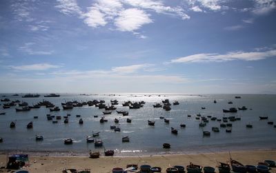 High angle view of boats on beach against sky