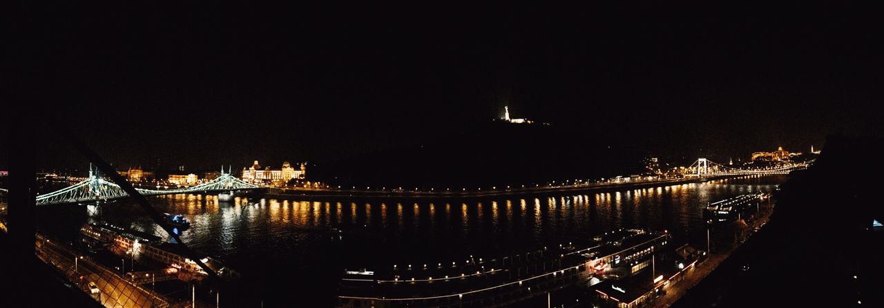 night, illuminated, architecture, built structure, building exterior, city, water, river, copy space, clear sky, cityscape, bridge - man made structure, transportation, travel destinations, sky, dark, reflection, lighting equipment, travel, connection