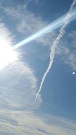 Low angle view of vapor trails in sky