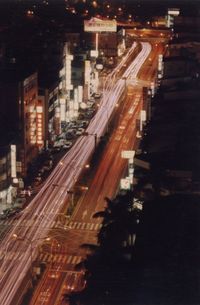 Illuminated city street at night