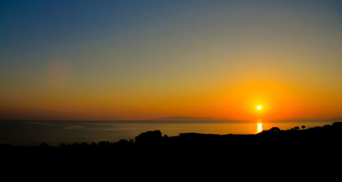 Scenic view of sunset over sea