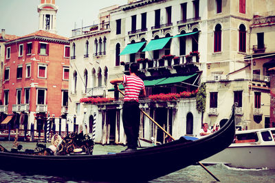 Boats moored in canal