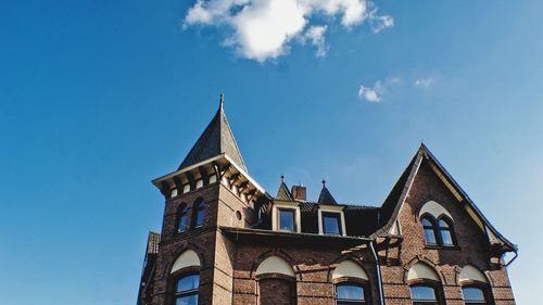 Low angle view of building against blue sky