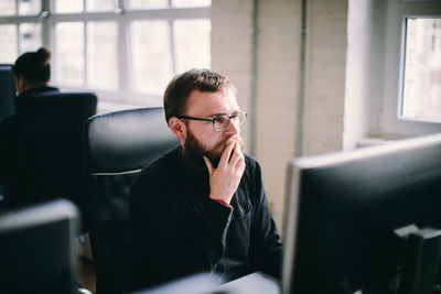 Mid adult man working in office