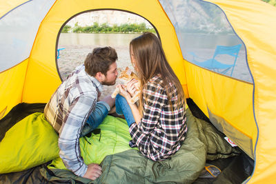 Young couple kissing in tent