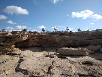 Rock formation on land against sky