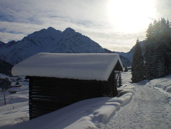 Snowcapped mountains against sky during winter