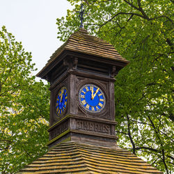 Low angle view of clock tower against sky