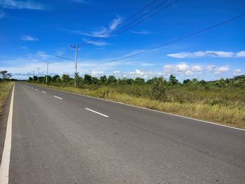 Empty road against sky