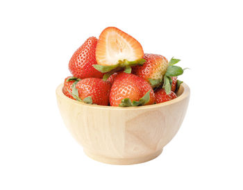 Close-up of strawberries in bowl against white background