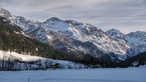 Scenic view of snowcapped mountains against sky