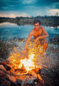 Full length of shirtless man in water