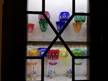 Close-up of multi colored glass on table