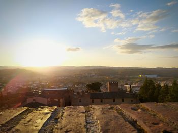 High angle shot of townscape against sky at sunset