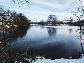 Scenic view of frozen lake against sky