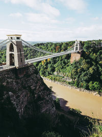 View of bridge over buildings against sky