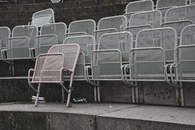Metallic seats on steps at stadium
