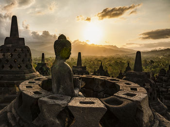 Panoramic view of temple against sky during sunset