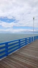 Pier over sea against sky