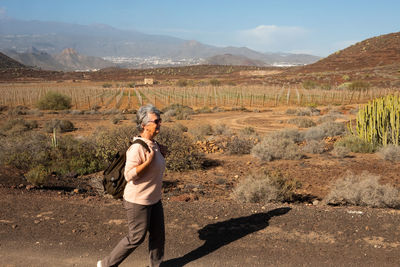 Woman walking on land