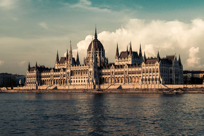 View of city against cloudy sky