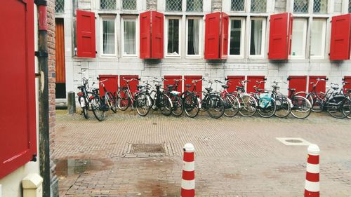 Bicycles parked against building