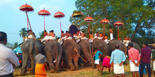 People in traditional clothing against sky