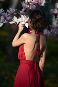 Rear view of woman holding bouquet