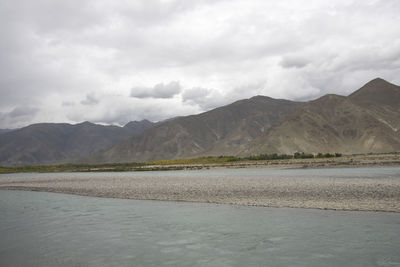 Scenic view of landscape and mountains against sky