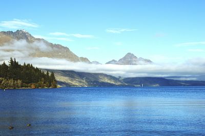 Scenic view of lake wakatipu by mountains against sky