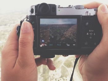 Cropped image of woman holding smart phone