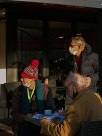 Side view of senior couple sitting at home