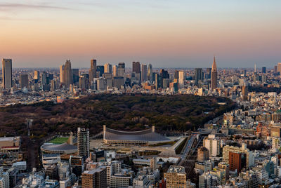 High angle view of buildings against sky during sunset