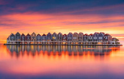 Scenic view of lake against sky during sunset