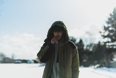 Portrait of teenage girl standing in snow