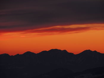 Silhouette mountains against dramatic sky