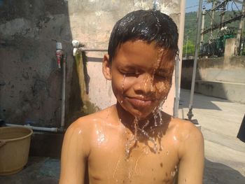 Small boy taking bath 