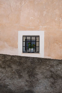 Full frame shot of window on wall of building