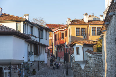 Buildings in city against clear sky