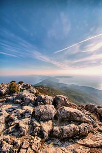 Scenic view of rocks and sea against sky