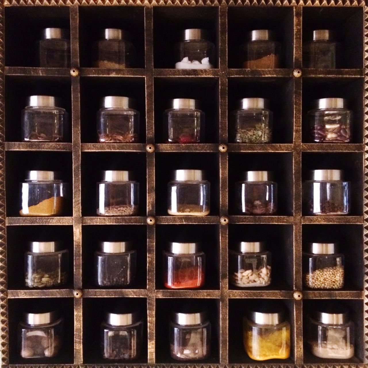 FULL FRAME SHOT OF BOTTLES ON SHELF AT STORE