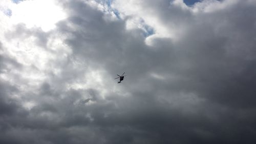 Low angle view of airplane flying in sky