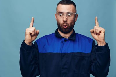 Portrait of young man against white background