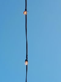 Low angle view of street light against clear sky