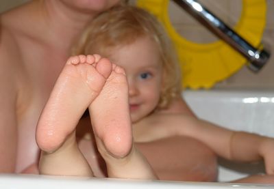 Midsection of woman in bathroom