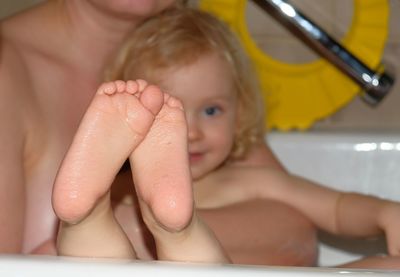 Midsection of woman in bathroom