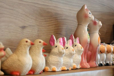 Close-up of stuffed toys on wood