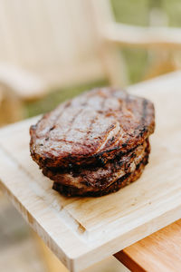 Close-up of bread on cutting board on table