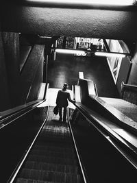 People walking on escalator