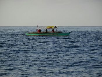 Boat sailing in sea